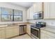 Kitchen with stainless steel appliances and granite countertops at 284 Crew Ct, Sarasota, FL 34243