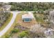 Beautiful aerial view of a private home, showcasing a screened pool, landscaping, and neighborhood at 2926 Sultan Ct, North Port, FL 34286