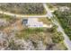 An aerial view of a home with a pool, highlighting the home's placement within a community at 2926 Sultan Ct, North Port, FL 34286