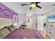 The bedroom leads into an en-suite bathroom with white cabinets at 2926 Sultan Ct, North Port, FL 34286