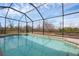 Refreshing screened pool with inviting cool blue water and a relaxing backyard at 2926 Sultan Ct, North Port, FL 34286