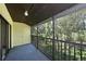 Screened balcony overlooking lush greenery at 3011 Quail Holw # 3011, Sarasota, FL 34235