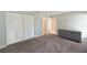 Bedroom with grey carpet and built in closet at 3011 Quail Holw # 3011, Sarasota, FL 34235