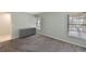 Bright bedroom with grey carpet and dresser at 3011 Quail Holw # 3011, Sarasota, FL 34235