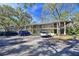 Two-story condo building with ample parking and lush landscaping at 3011 Quail Holw # 3011, Sarasota, FL 34235