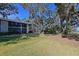 Building exterior with surrounding green space at 3011 Quail Holw # 3011, Sarasota, FL 34235