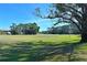 Landscaped green space with golf course in background at 3011 Quail Holw # 3011, Sarasota, FL 34235