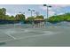 Well-maintained tennis court with seating at 3011 Quail Holw # 3011, Sarasota, FL 34235