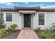 Home features a black front door and well-manicured landscaping at 3016 Formia Ct, Bradenton, FL 34211