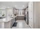 Modern kitchen with gray cabinets, quartz counters, and stainless steel appliances at 3016 Formia Ct, Bradenton, FL 34211