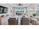 Bright living room with comfy seating, large TV, and sliding glass doors leading to a screened patio at 3016 Formia Ct, Bradenton, FL 34211