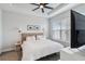 Spacious main bedroom with large windows, a dresser and a wall-mounted TV at 3016 Formia Ct, Bradenton, FL 34211