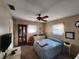 Bright bedroom with double bed and ceiling fan at 310 Parkland Ave, Sarasota, FL 34232