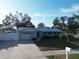 Light blue home with metal roof and white fence at 310 Parkland Ave, Sarasota, FL 34232