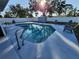 Relaxing kidney-shaped pool in sunny backyard at 310 Parkland Ave, Sarasota, FL 34232