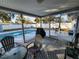 Screened poolside patio with seating at 310 Parkland Ave, Sarasota, FL 34232