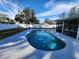 Inviting kidney-shaped pool in the backyard at 310 Parkland Ave, Sarasota, FL 34232