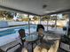 Screened poolside patio with seating at 310 Parkland Ave, Sarasota, FL 34232