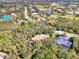 Bird's eye view of home, highlighting its location in a quiet, wooded neighborhood at 3142 Dick Wilson Dr, Sarasota, FL 34240