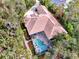 Aerial view of a home with a large pool and lush landscaping at 3142 Dick Wilson Dr, Sarasota, FL 34240