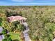 Bird's-eye view of home showcasing its driveway and surrounding nature at 3142 Dick Wilson Dr, Sarasota, FL 34240