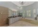 Elegant bathroom with soaking tub, double vanity, and marble flooring at 3142 Dick Wilson Dr, Sarasota, FL 34240