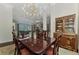 Bright dining room with a chandelier and view of the living room at 3142 Dick Wilson Dr, Sarasota, FL 34240