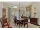 Formal dining room with chandelier and hardwood floors at 3142 Dick Wilson Dr, Sarasota, FL 34240