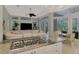 Open kitchen with breakfast bar overlooks Gathering room and pool area at 3142 Dick Wilson Dr, Sarasota, FL 34240