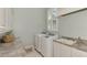 Bright laundry room, featuring washer, dryer, and ample counter space at 3142 Dick Wilson Dr, Sarasota, FL 34240