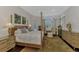 Spacious main bedroom with a large bed, plenty of light, and hardwood floors at 3142 Dick Wilson Dr, Sarasota, FL 34240