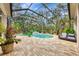 Beautiful screened pool area features a spa and plenty of space for relaxation at 3142 Dick Wilson Dr, Sarasota, FL 34240