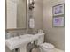 Elegant powder room with decorative walls and pedestal sink at 3142 Dick Wilson Dr, Sarasota, FL 34240