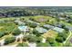 Aerial view of community tennis courts and pool at 3142 Dick Wilson Dr, Sarasota, FL 34240