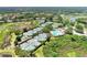 Aerial view of community tennis courts and pool at 3142 Dick Wilson Dr, Sarasota, FL 34240