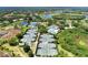 Aerial view of community tennis courts and pool at 3142 Dick Wilson Dr, Sarasota, FL 34240