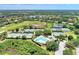 Aerial view of community tennis courts and pool at 3142 Dick Wilson Dr, Sarasota, FL 34240