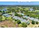 Aerial view of community tennis courts and pool at 3142 Dick Wilson Dr, Sarasota, FL 34240