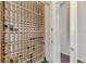 Walk-in wine cellar with custom wooden racking at 3142 Dick Wilson Dr, Sarasota, FL 34240