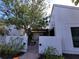 Front view of a house with a courtyard entry and white exterior walls at 3455 Anglin Dr, Sarasota, FL 34242