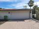 White garage door and brick paved driveway at 3455 Anglin Dr, Sarasota, FL 34242