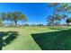 Landscaped backyard with golf course view at 3500 El Conquistador Pkwy # 119, Bradenton, FL 34210