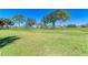 View of grassy backyard and golf course at 3500 El Conquistador Pkwy # 119, Bradenton, FL 34210