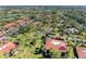 Aerial view of community showcasing multiple buildings, landscaping and roads at 3500 El Conquistador Pkwy # 119, Bradenton, FL 34210