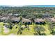 Aerial view of community featuring villas, lush landscaping, and golf course at 3500 El Conquistador Pkwy # 119, Bradenton, FL 34210