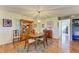 Elegant dining room featuring hardwood floors and a chandelier at 3500 El Conquistador Pkwy # 119, Bradenton, FL 34210