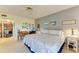 Main bedroom with king-size bed and calming decor at 3500 El Conquistador Pkwy # 119, Bradenton, FL 34210