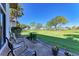 Relaxing patio overlooking a lush green golf course at 3500 El Conquistador Pkwy # 119, Bradenton, FL 34210