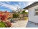 Backyard patio with wooden deck and tropical plants at 3762 San Luis Dr, Sarasota, FL 34235