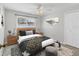 Bedroom with wood nightstands and window at 3762 San Luis Dr, Sarasota, FL 34235